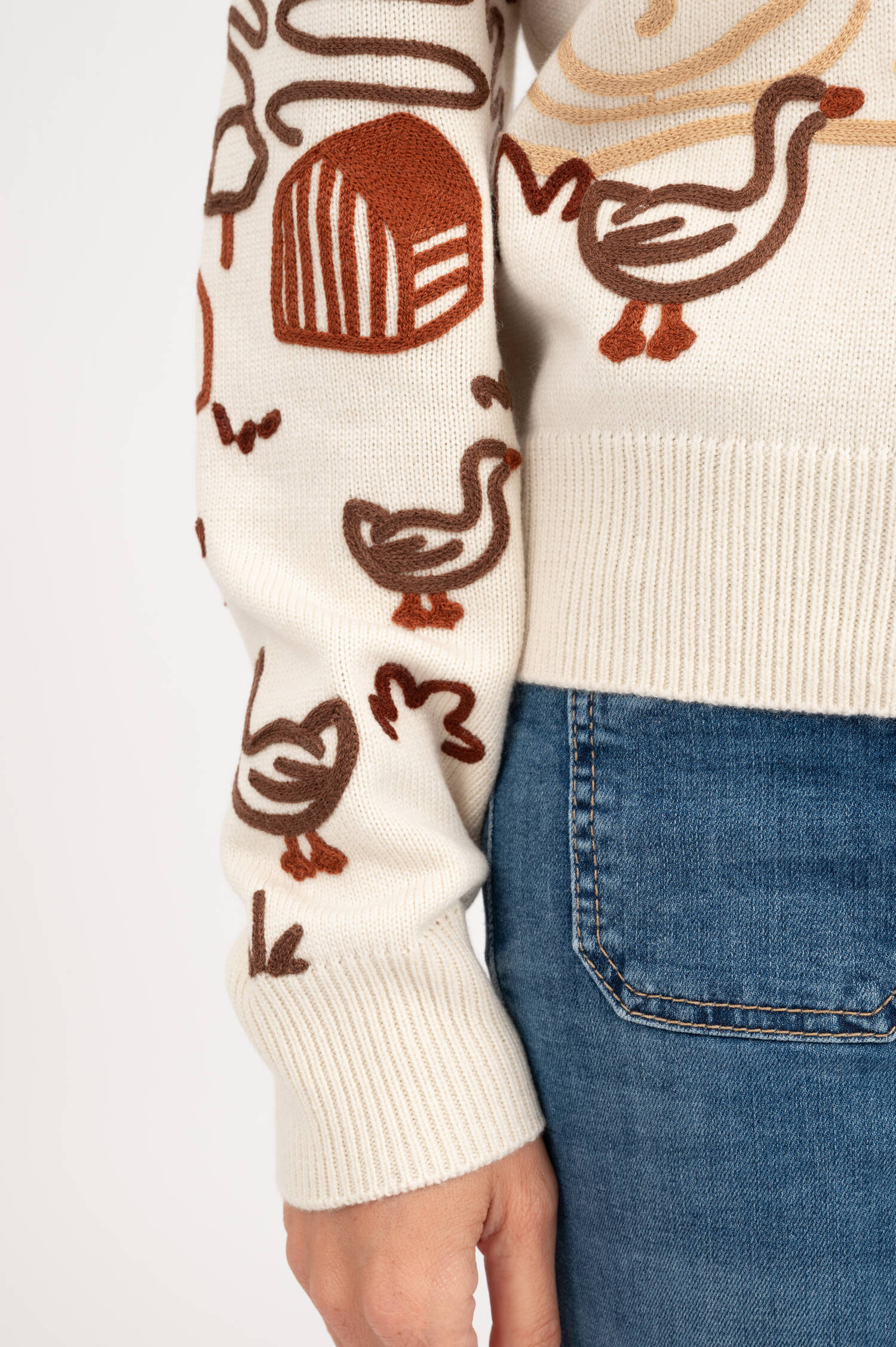 Strickweste mit Stick-Motiven in Creme Strickweste mit Stick-Motiven in Creme