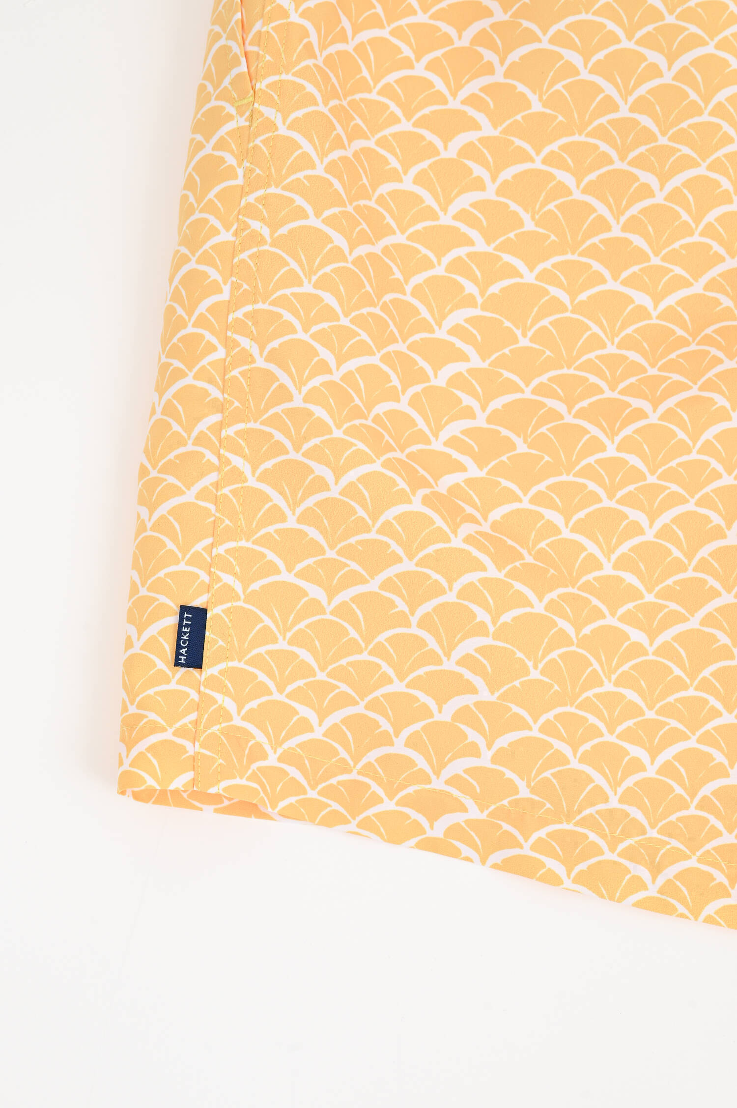 Badeshorts mit Print in Gelb/Weiß