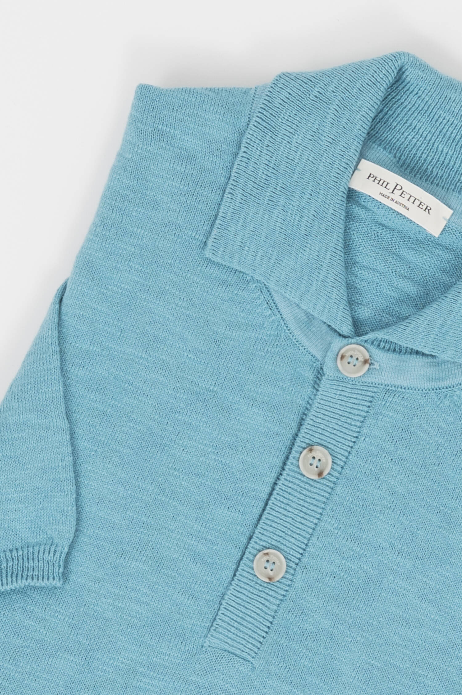 Srickpolo in Türkisblau