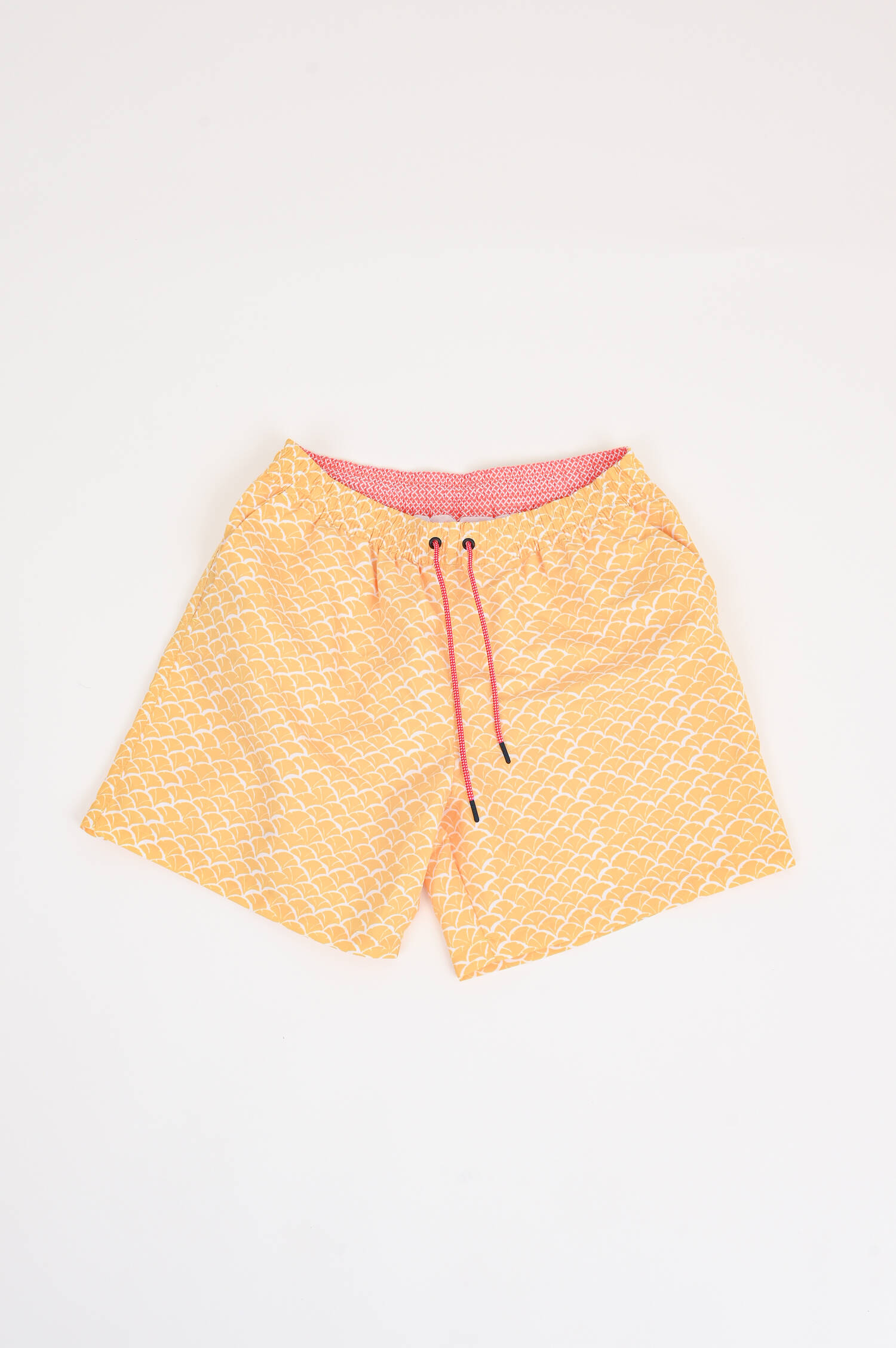 Badeshorts mit Print in Gelb/Weiß